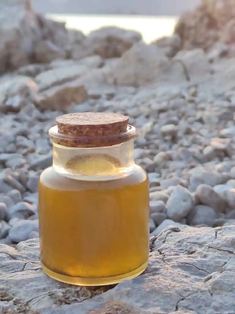 Image of a bottle of homemade helichrysum oil in Croatia 