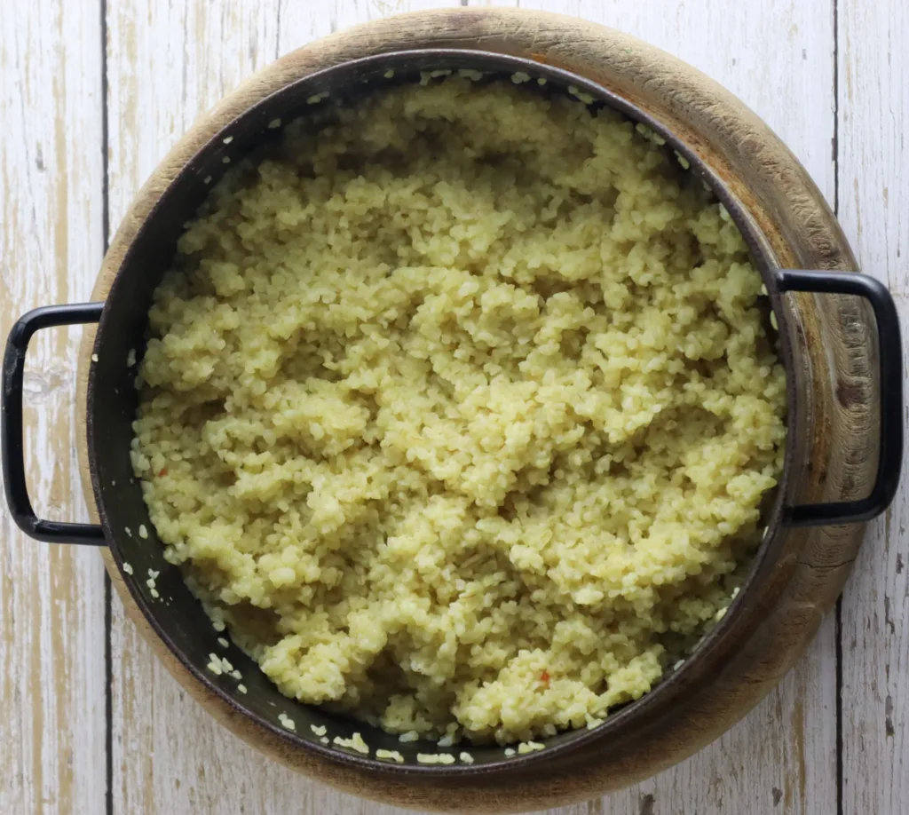 image showing cooked bulgur cooling down to room temperature before making the salad