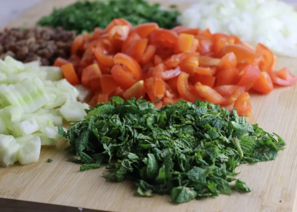 how to dice tomatoes, cucumber and chop parsley and mint