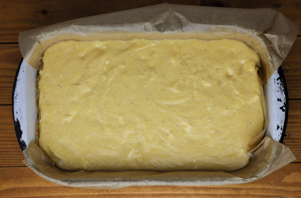 how to add the polenta bread mixture to the pan 