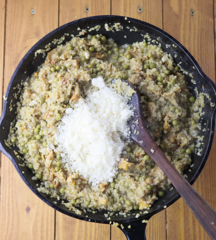 Image showing how to add parmesan cheese to risotto. 