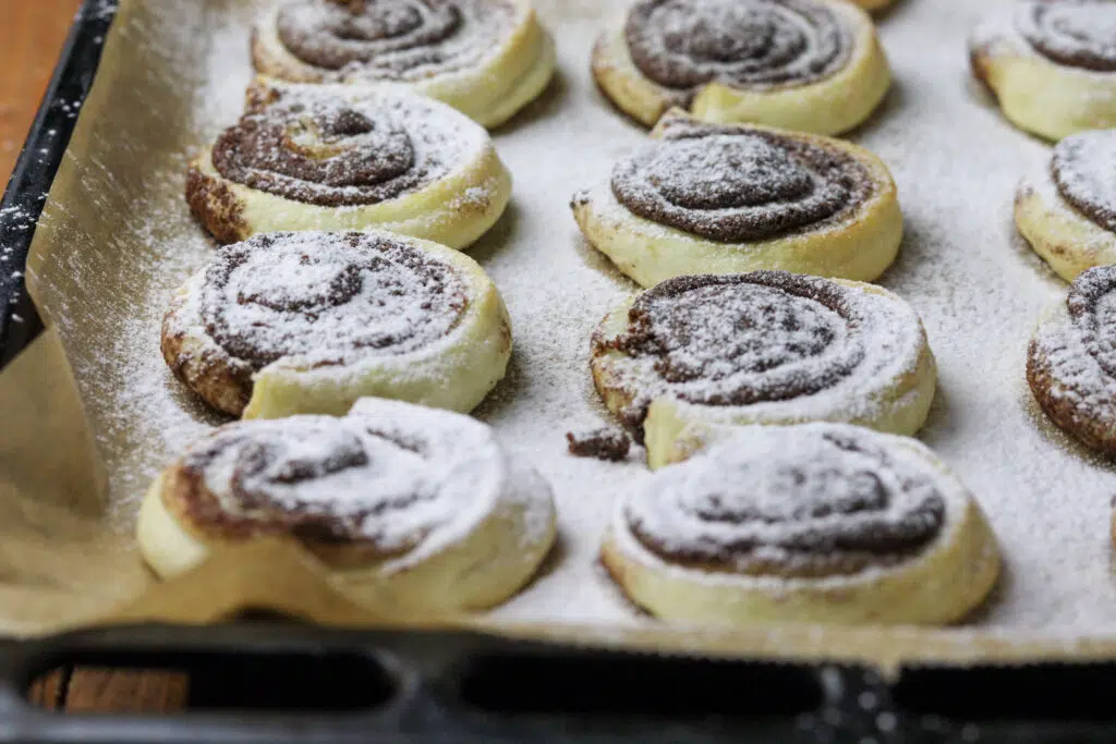 puff pastry cinnamon pinwheels on a baking sheet